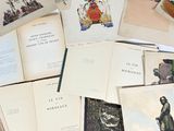 a lot of books that are sitting on a table