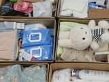 several boxes of baby items are stacked on top of each other