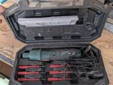 a person holding a tool in a case on a table