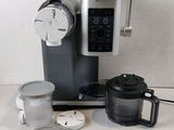 a coffee maker and a blender sitting on a counter