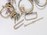 a lot of brass items that are on a white surface
