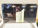 a picture of a large screen tv on display in a store