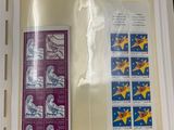 a picture of a book with stamps in it on a table
