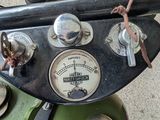 a close up of the gauges on the handlebars of a scooter