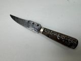 a knife that is sitting on a table