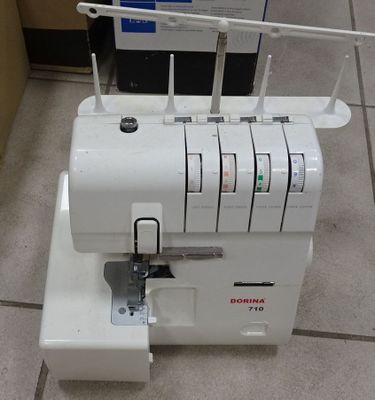 a sewing machine that is sitting on the floor