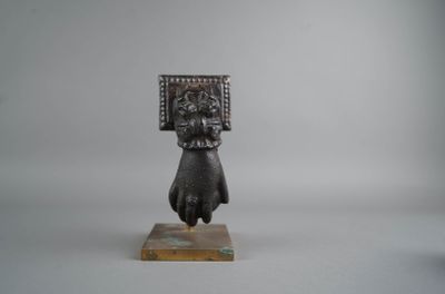 an image of a statue of a woman holding a box on her head