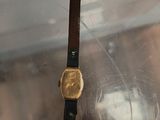 a watch that is sitting on top of a glass table