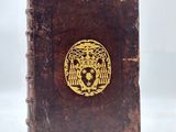 a brown book with a gold lion on it