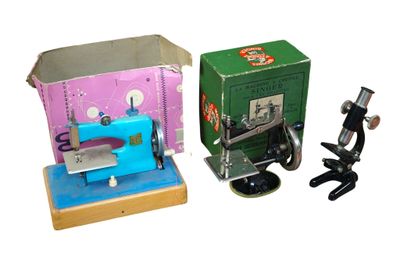 two sewing machines sitting next to each other on a table