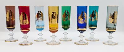 seven different colored wine glasses lined up in a row