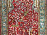 a red rug with a floral design on it