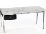 a marble desk with a black drawer underneath it