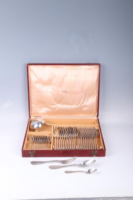 a box with silverware in it on a table