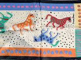 an image of a scarf with a picture of animals on it