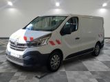 the white van is parked on a checkered floor in the garage