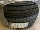 a close up of a car tire with a plastic wrap around it