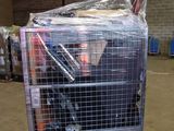 a metal cart with many items in it in a warehouse