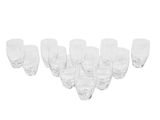 six clear wine glasses lined up in a row on a white surface