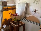 a room that has a bunch of boxes and a radiator in it