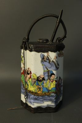 a small bag with a handle that has a picture of people on it