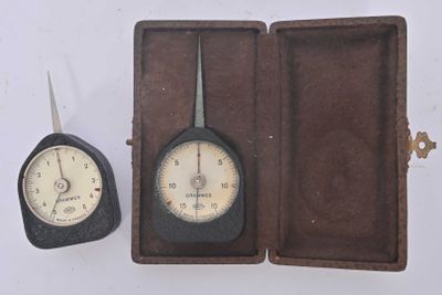 a clock and a pair of scissors in a case