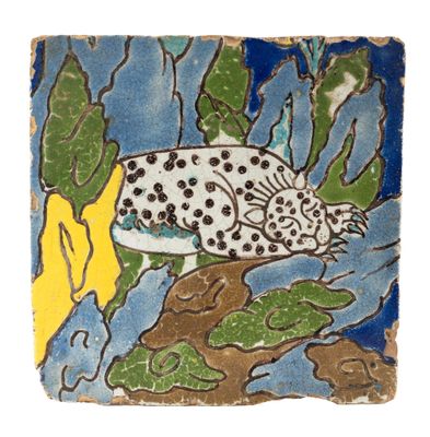 an image of a ceramic tile with a fish on it