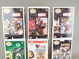 a lot of comic books on display on the table