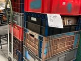 many crates stacked on top of each other in a store