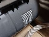 an image of a blower motor with a hose attached to it