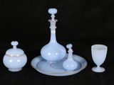 a picture of a set of blue and white glass items