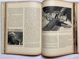 an open book with a picture of a plane in it