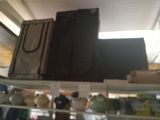 a black bag hanging from the ceiling of a store