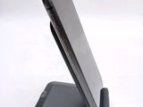 a cell phone that is sitting on top of a stand