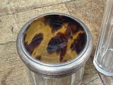 a plastic container with a tortoise on it next to a plastic container with a plastic lid