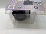 a plastic container with a black object inside of it