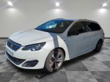 the white car is parked on a checkered floor in the garage