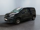 the black van is parked in the empty room of the building
