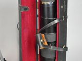 a black and red case with a silver object inside of it
