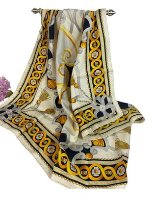 écharpe jaune, noire et blanche ornée d'un motif représentant des lions et des fleurs