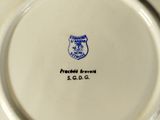 a white plate with a blue and white design on it