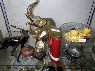 a glass table with a lot of different items on it