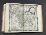an open book with a map of the country of england