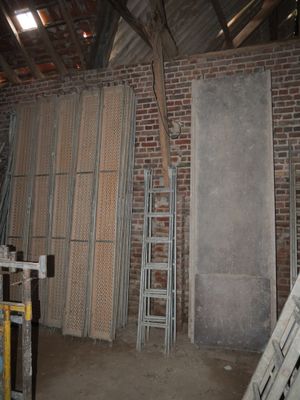 a picture of a room with a ladder and a brick wall