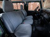 the interior of a van with two seats and a steering wheel