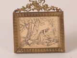 un vieux cadre contenant le dessin d'une femme assise sous un arbre