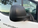 a white truck with a black side mirror on the side of it