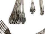 a set of silverware on a white background