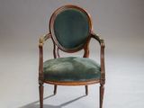an image of a chair with a green upholstered seat