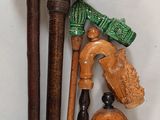 a lot of different types of walking canes on the table
